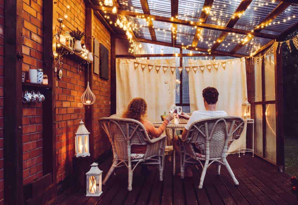 Young man and woman enjoying LED lights